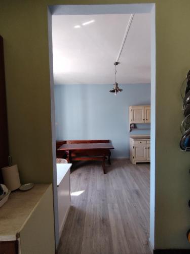 an open door to a kitchen with a pool table at La casa colorata con vista in Borgomaro