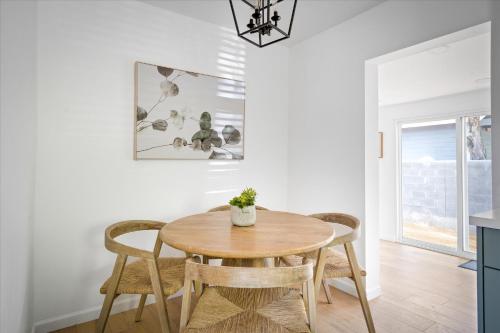 a dining room with a wooden table and chairs at Old Town Stunner in Cottonwood