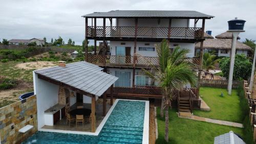 an aerial view of a house with a swimming pool at Home Beach at a Small Village in Cajueiro da Praia - Piauí - Brazil in Cajueiro