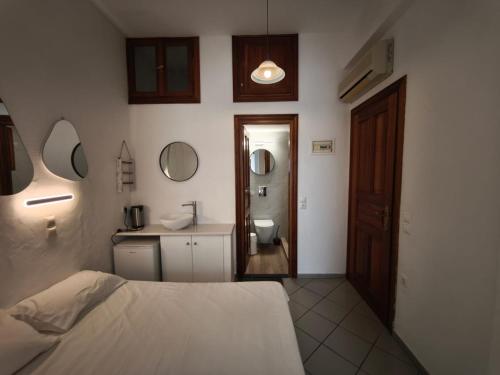 Ένα ή περισσότερα κρεβάτια σε δωμάτιο στο Maria Eleni Guesthouse