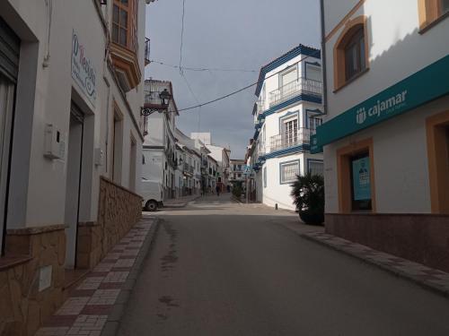 an empty street in an alley between buildings at La Casita 18 in Ardales
