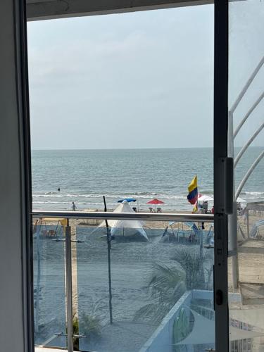 a view of the beach from a window at habitacion con vista al mar in Cartagena de Indias