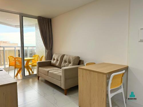 a living room with a couch and a table at Aquarius Style by Holiday Stays in Fortaleza
