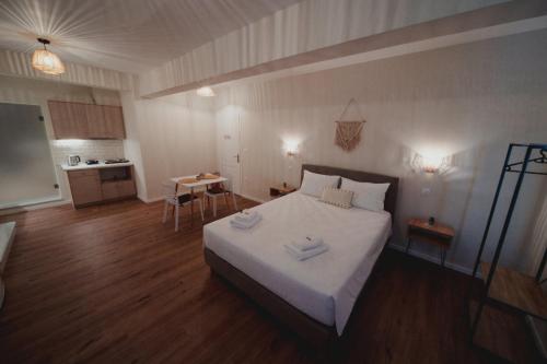 a bedroom with a bed with two towels on it at Andromeda 102 apartments in Spáta