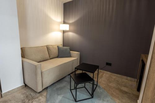a living room with a couch and a table at Boka Bay Residences in Herceg-Novi