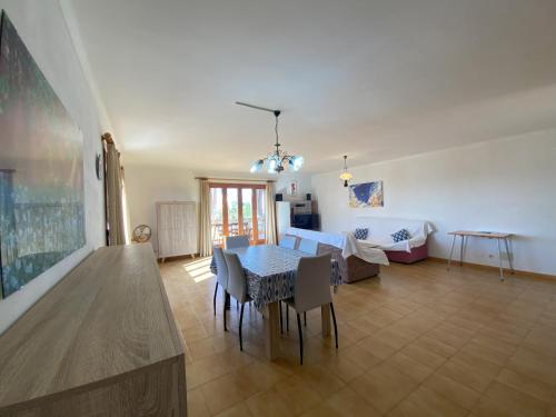 a living room with a table and a couch at Casa Ventura in Felanitx