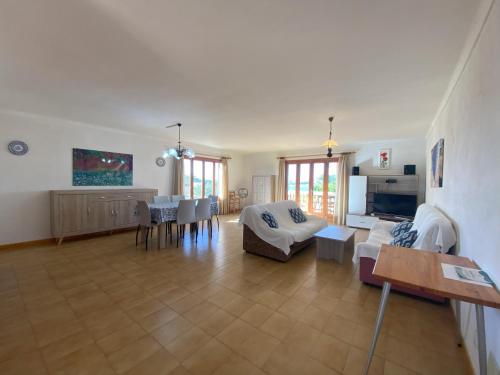 a living room with a couch and a table at Casa Ventura in Felanitx