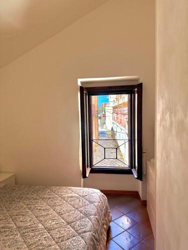a bedroom with a window with a view of a street at Santa Caterina in Brindisi