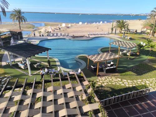 an aerial view of a resort with a beach at La Posada Hotel Boutique in La Paz