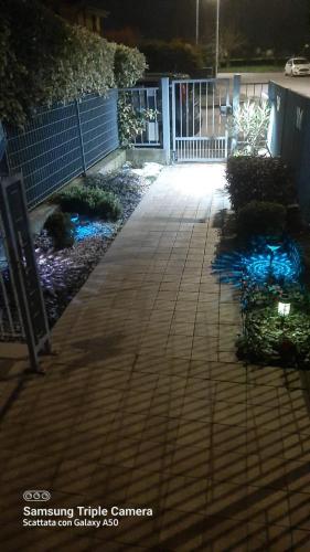 a walkway in front of a building at night at Casa Maria in Cigole