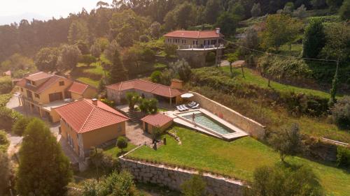an aerial view of a house with a swimming pool at Casa da Chitas in Ponte de Lima
