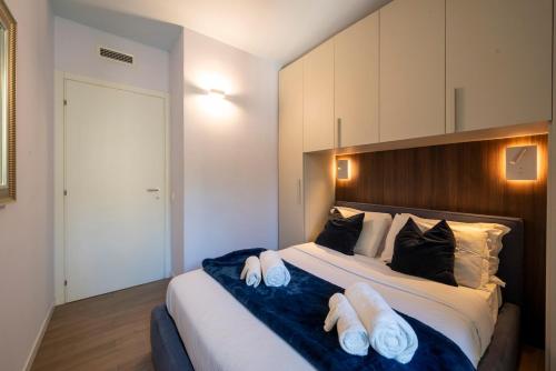 Ένα ή περισσότερα κρεβάτια σε δωμάτιο στο Duomo Design - Bilocale-Wifi-Aircon
