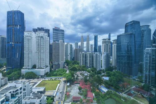an aerial view of a city with tall buildings at Eaton Residence KLCC in Kuala Lumpur