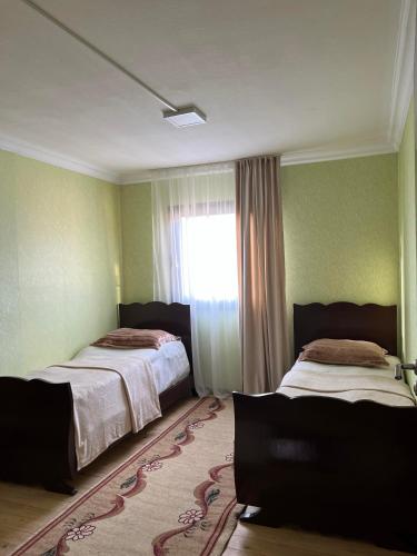 Llit o llits en una habitació de Dili home