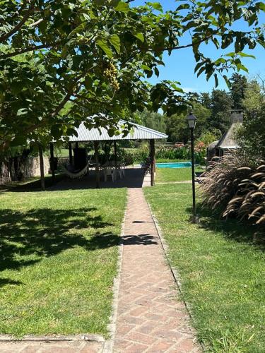 a path in a park with a gazebo at Casa Mozart in Victoria