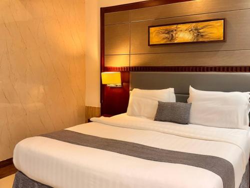 a bedroom with two beds in a hotel room at Quiet Rooms 12 in Riyadh