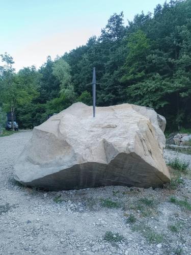 a large rock with a cross on top of it at La Casa di Agnese in San Benedetto Val di Sambro