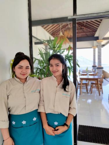 two women are standing next to each other at Batur view Homestay - Loft in Kintamani