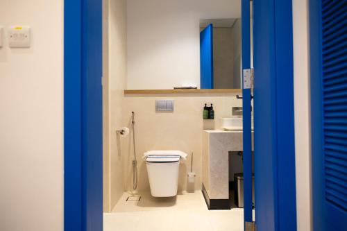 a bathroom with a toilet and a sink at شاليهات مايرون - Myron Chalets in Riyadh