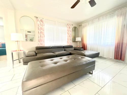 a living room with a couch and a table at 4 miles to Siesta Key Beach #1 in America in Sarasota