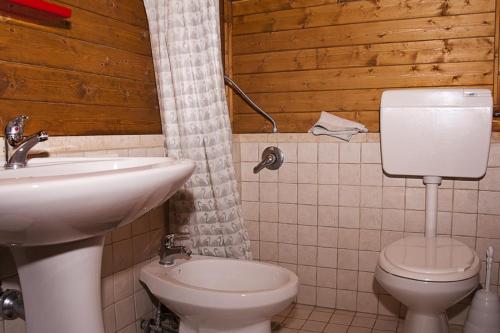 a bathroom with a sink and a toilet at Pets under the Sun in Alberobello