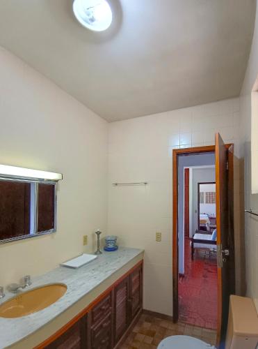 a bathroom with a sink and a toilet at Aurora Homestead in Araras Petropolis
