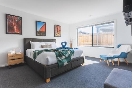 a bedroom with a bed and a window at Sauna, King Beds, Tranquility Base Fun Large Home in Saint Leonards