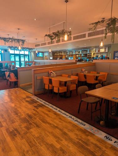 a restaurant with tables and chairs and a bar at BEAUTIFUL LUXURY Caravan HAVEN LITTLESEA STUNNING VIEWS Sleeps 6 in Weymouth