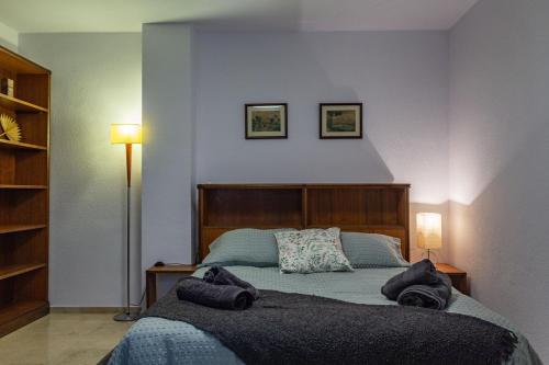Una cama o camas en una habitación de CMApartamentos