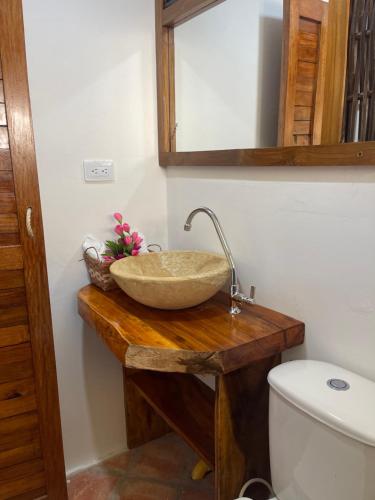 a bathroom with a sink and a toilet at Casa Arrecife San Bernardo del Viento in San Bernardo del Viento
