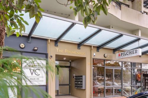 a store front with a building with skylights at Spacious 2-Bed 2-Bath Moments from Avalon Beach in Avalon