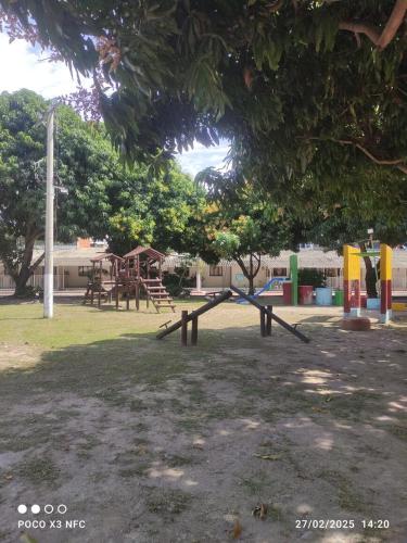 a park with a swing set and a playground at Casa Vacacional Flandes-Tolima in Flandes