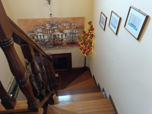 a stairway with a painting on the wall at MESONISI maisonette in Afissos