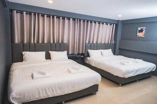 Una cama o camas en una habitación de Bridge Donmueang