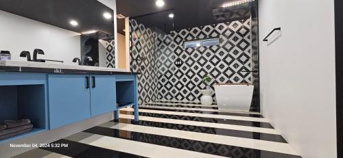 a staircase in a kitchen with a geometric wall at 5 Bdr 4 Bth Walk to Old Town 12 min Airport POOL table in Scottsdale
