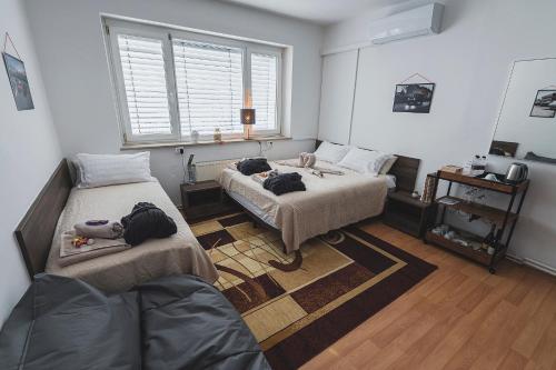 Postel nebo postele na pokoji v ubytování DO AVTA Rooms