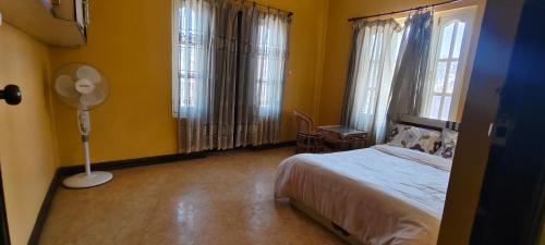 Letto o letti in una camera di Heritage View Homestay