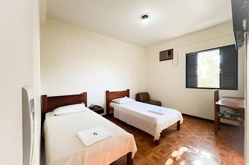 Una cama o camas en una habitación de LN Flats & Suites