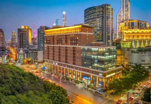 a city skyline at night with traffic and buildings at Green Court Residence City Center, Shanghai in Shanghai