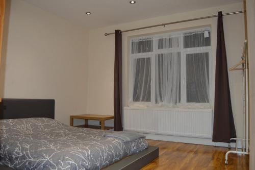 Ένα ή περισσότερα κρεβάτια σε δωμάτιο στο Nice One Bedroom Flat