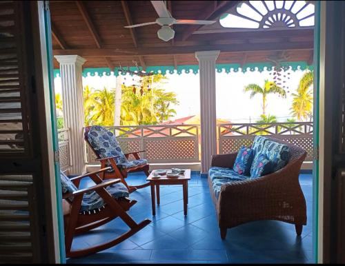 a living room with two chairs and a table at A La Dolce Vita Beachfront Hotels, Las Terrenas, Samana in Las Terrenas