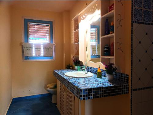 a bathroom with a sink and a toilet at A La Dolce Vita Beachfront Hotels, Las Terrenas, Samana in Las Terrenas