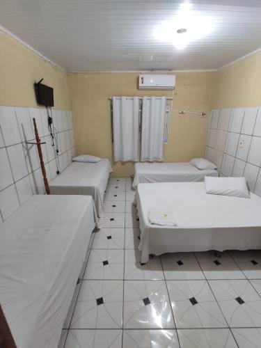 Katil atau katil-katil dalam bilik di Hotel Líder
