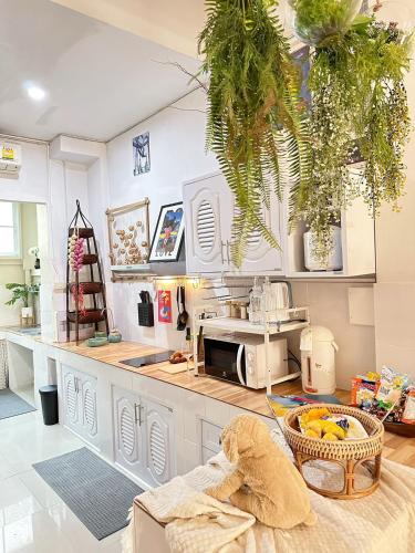a kitchen with a sink and a counter top at candy house ที่พักวัวลาย เชียงใหม่ in Chiang Mai