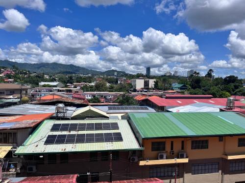 a group of buildings with solar panels on their roofs at Cebu Grand Hotel in Cebu City
