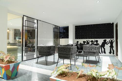 a group of people sitting around a table in a house at HOTEl EUPHORIA AIRPORT Zone in Hyderabad