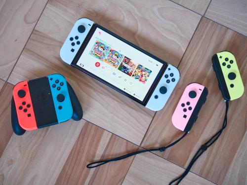 two video game controllers sitting on top of a floor at Blue Ocean Awaji in Sumoto