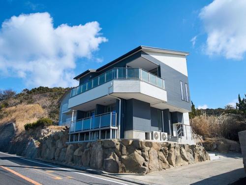 a building on top of a rock wall at Blue Ocean Awaji in Sumoto
