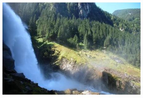 an aerial view of a waterfall in a valley at Ferienwohnung Trattenhaus in Krimml