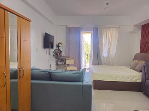 Una cama o camas en una habitación de V- Studio Unit